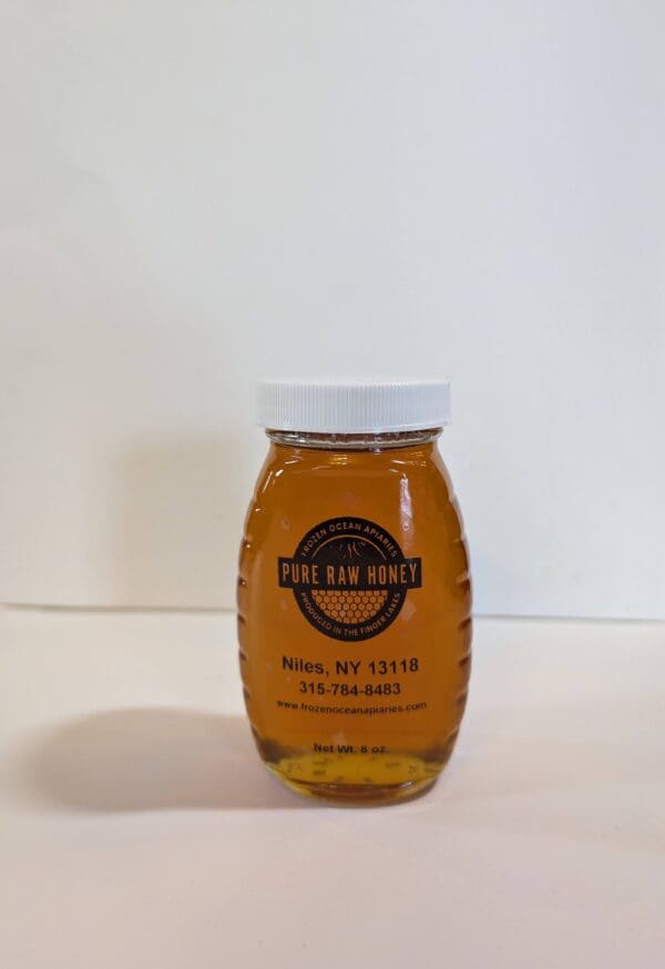 A jar of honey on the counter